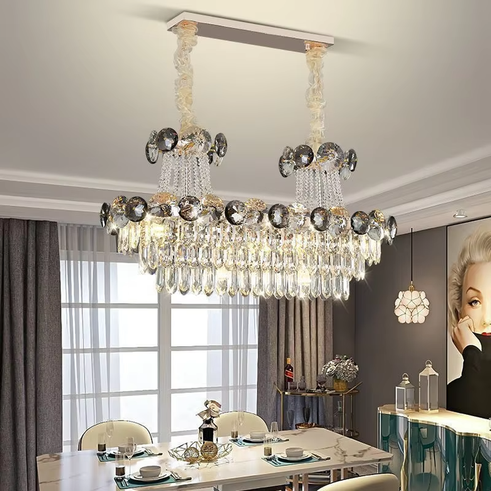 This is a luxurious classical multi-layer crystal chandelier, combining transparent and smoky gray crystals with a multi-layer hanging design. It features brilliant lighting and grand luxury. It is used for space lighting and decoration, creating a luxurious and noble atmosphere. Suitable for luxury living rooms, high-end hotel lobbies, villa banquet halls and other places.