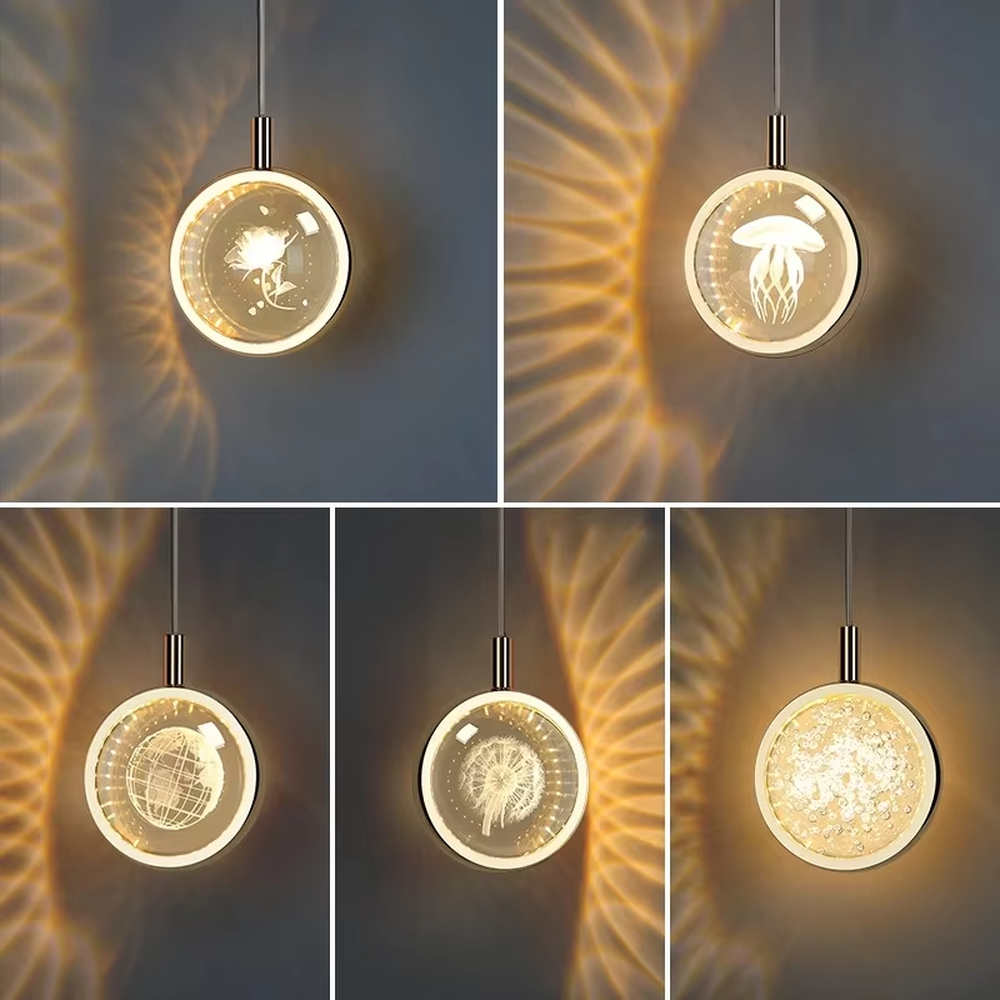 This light luxury small round chandelier features a gold metal frame, a transparent panel with delicate patterns such as jellyfish/birds, and projects ripple light and shadow on the wall when lit, serving both lighting and decorative purposes, ideal for bedroom bedside tables, light luxury homestays, high-end hotel rooms and other spaces.