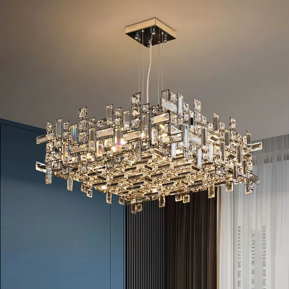 This is a modern luxurious rectangular crystal block combination chandelier, composed of a large number of transparent cut crystal blocks irregularly spliced into a rectangular shape, paired with a metal frame. The light through the crystals is brilliant and bright, creating a high-end modern luxurious atmosphere.