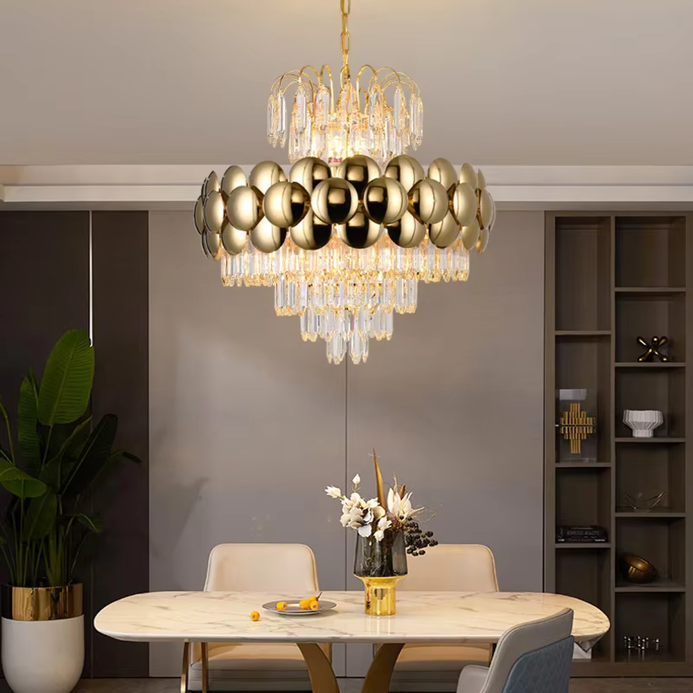 This is a luxurious modern-style golden spherical crystal multi-layer chandelier, combining golden metal spherical elements with multi-layer crystals. It features a grand and luxurious design with brilliant lighting. It is used for space lighting and decoration, creating a high-end luxurious atmosphere. Suitable for light luxury-style restaurants, luxury living rooms, high-end hotel banquet halls and other places.