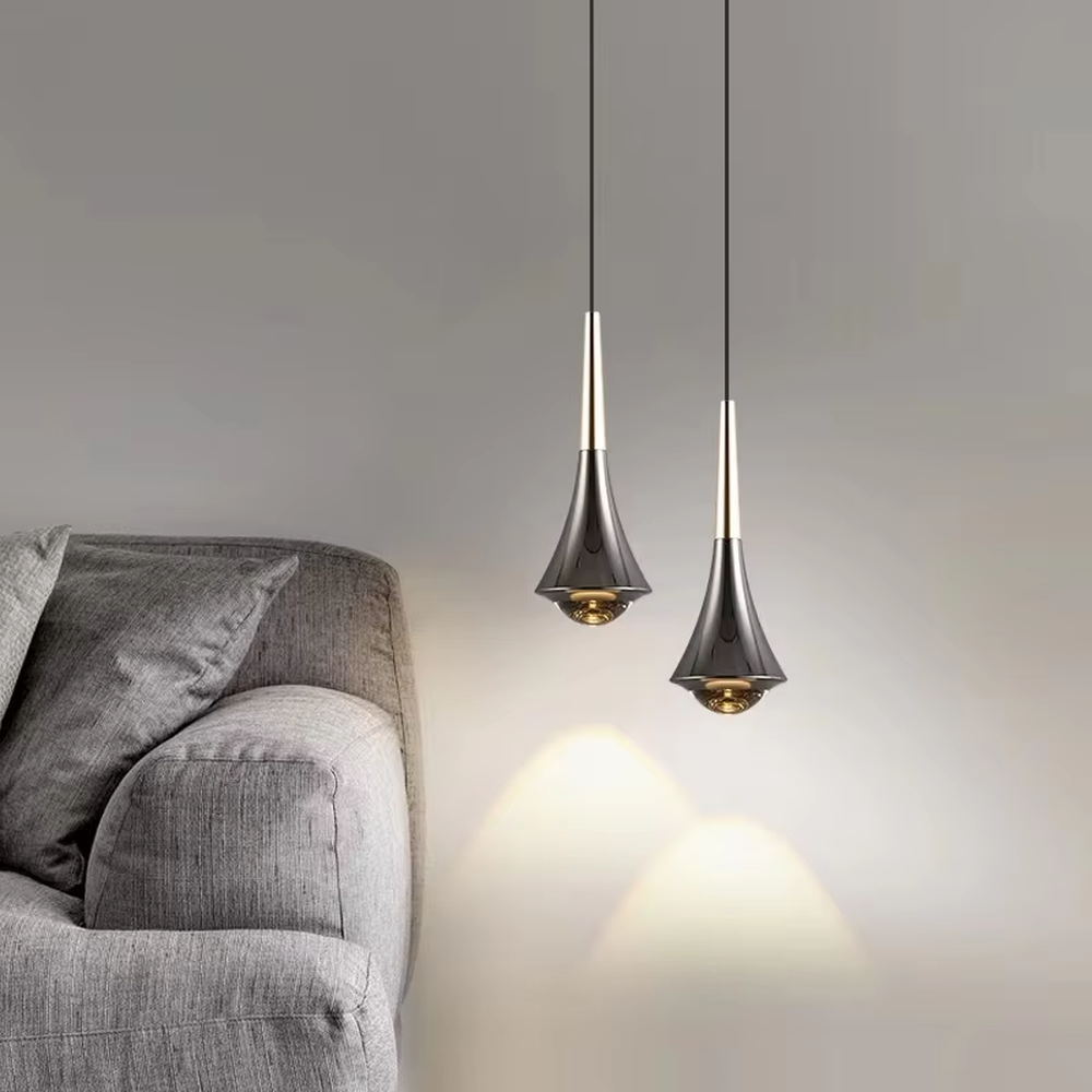 This minimalist light luxury conical small chandelier features a water-drop shape made of black-gold metal, with a thin gold rod on top, projecting soft light spots, serving both lighting and decorative purposes, ideal for bedroom bedside tables, dining bars, light luxury commercial spaces and other scenarios.