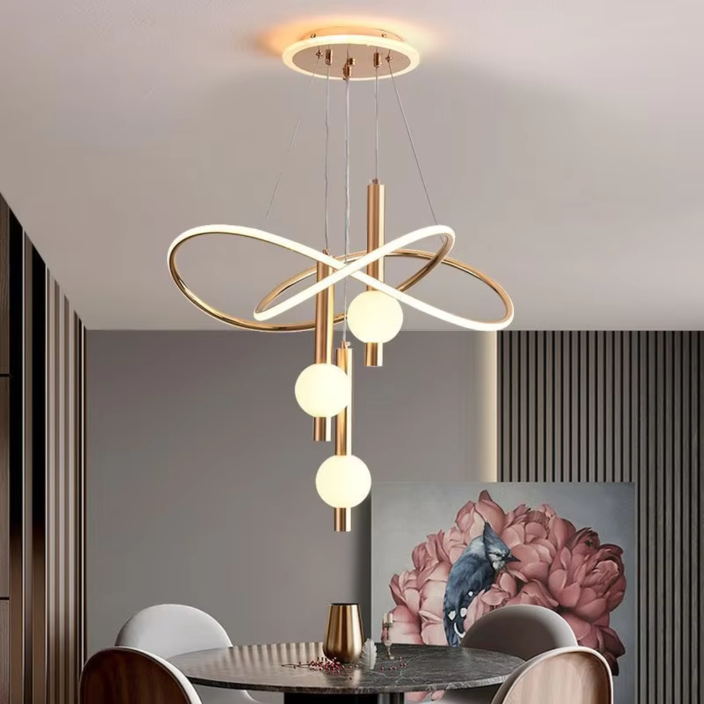 This is a modern creative cross-ring spherical chandelier, featuring white cross-ring light strips paired with spherical lamp bodies. The design is simple and artistic, with soft and uniform lighting. It is used for space lighting and decoration to create a modern artistic atmosphere. Suitable for modern-style living rooms, minimalist dining areas, modern apartments and other places.