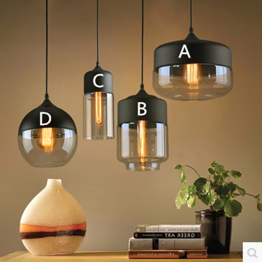 This set of Nordic-style creative small chandeliers features black metal top covers paired with amber glass lampshades, with various shapes that can be hung in combination, serving both lighting and decorative purposes, ideal for dining rooms, bars, Nordic-style homes and other scenarios.