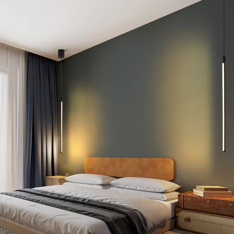 This minimalist linear chandelier features a slender black metal lamp body with a floating suspension design, emitting soft diffused light, serving both lighting and decorative purposes, ideal for bedroom bedside tables, living room feature walls, modern minimalist homes and other scenarios.