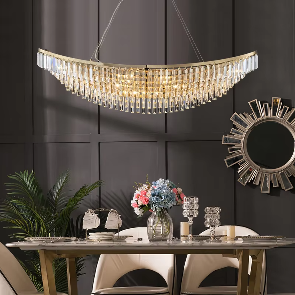 Light luxury golden curved long crystal chandelier, decorated with transparent crystal strips, brilliant and high-end lighting, creating a high-end light luxury atmosphere.