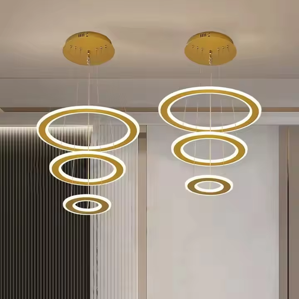 This is a modern minimalist three-layer circular hanging chandelier, featuring a multi-layer hanging design with white circular light strips. It has a simple and grand style, with soft and uniform lighting. It is used for space lighting and decoration to create a minimalist modern atmosphere. Suitable for modern kitchen dining areas, minimalist living rooms, modern apartment dining areas and other places.