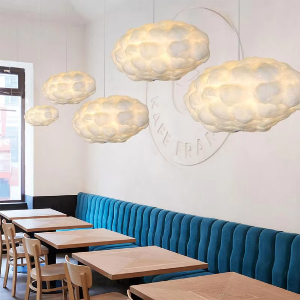This dreamy cloud-shaped chandelier is made of fluffy fiber/fabric material, simulating the shape of real clouds, transmitting light softly and hung in varying sizes. It serves both lighting and decorative purposes, ideal for Internet celebrity restaurants, cafes, children's rooms, cultural and creative spaces and other scenarios.