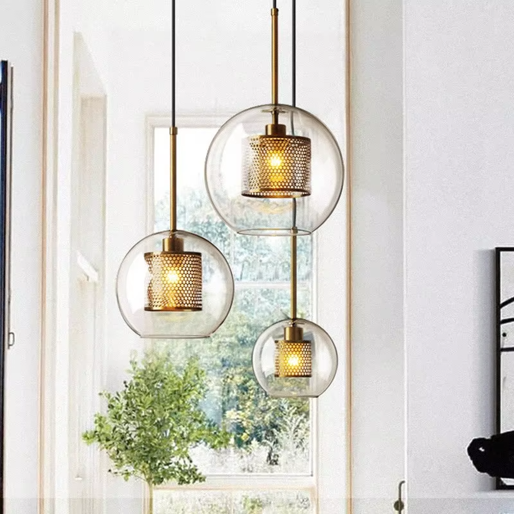 Modern light luxury golden mesh shade glass ball chandelier (multi-size combination), warm light effect, creating an exquisite layered minimalist space atmosphere.
