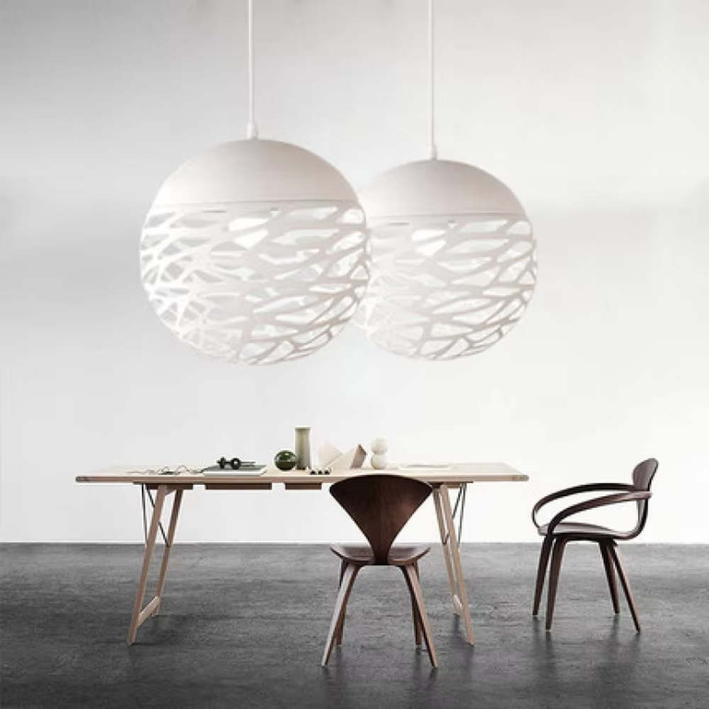 This minimalist hollow spherical chandelier features irregular hollow textures made of metal, available in black and white color options. It emits soft diffused light when lit, serving both lighting and decorative purposes, ideal for dining rooms, living rooms, modern homes and other scenarios.
