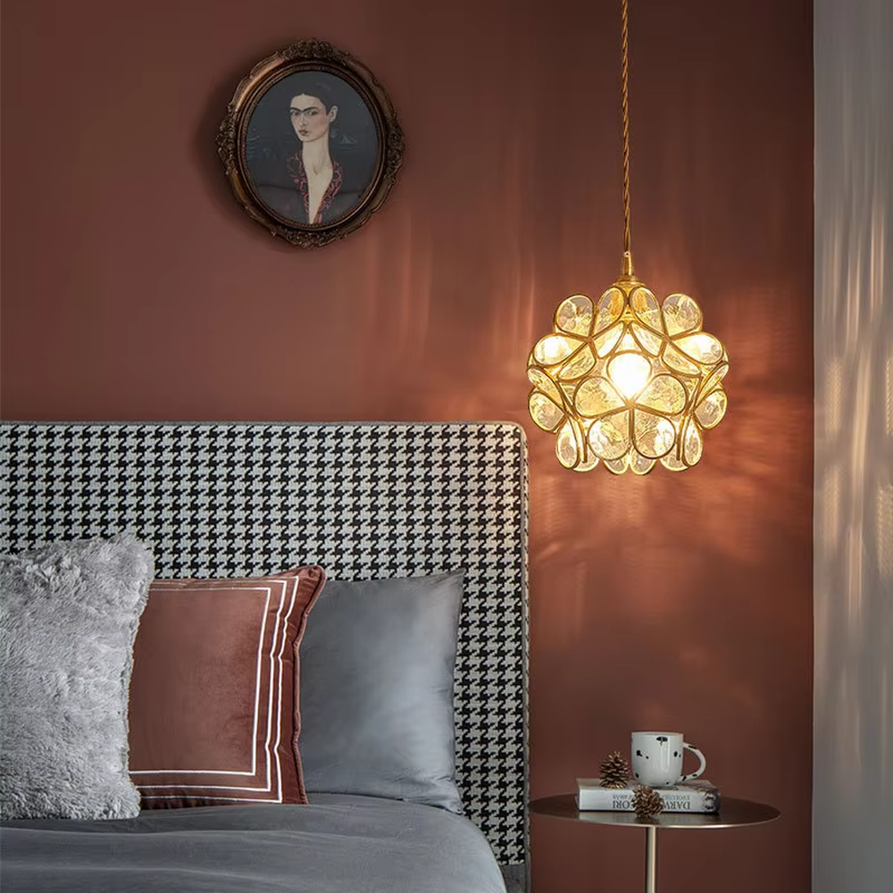 Retro light luxury petal spherical chandelier, golden metal petal frame + textured transparent glass panels + jute rope hanger, soft warm light with textured light and shadow, creating a warm artistic atmosphere.