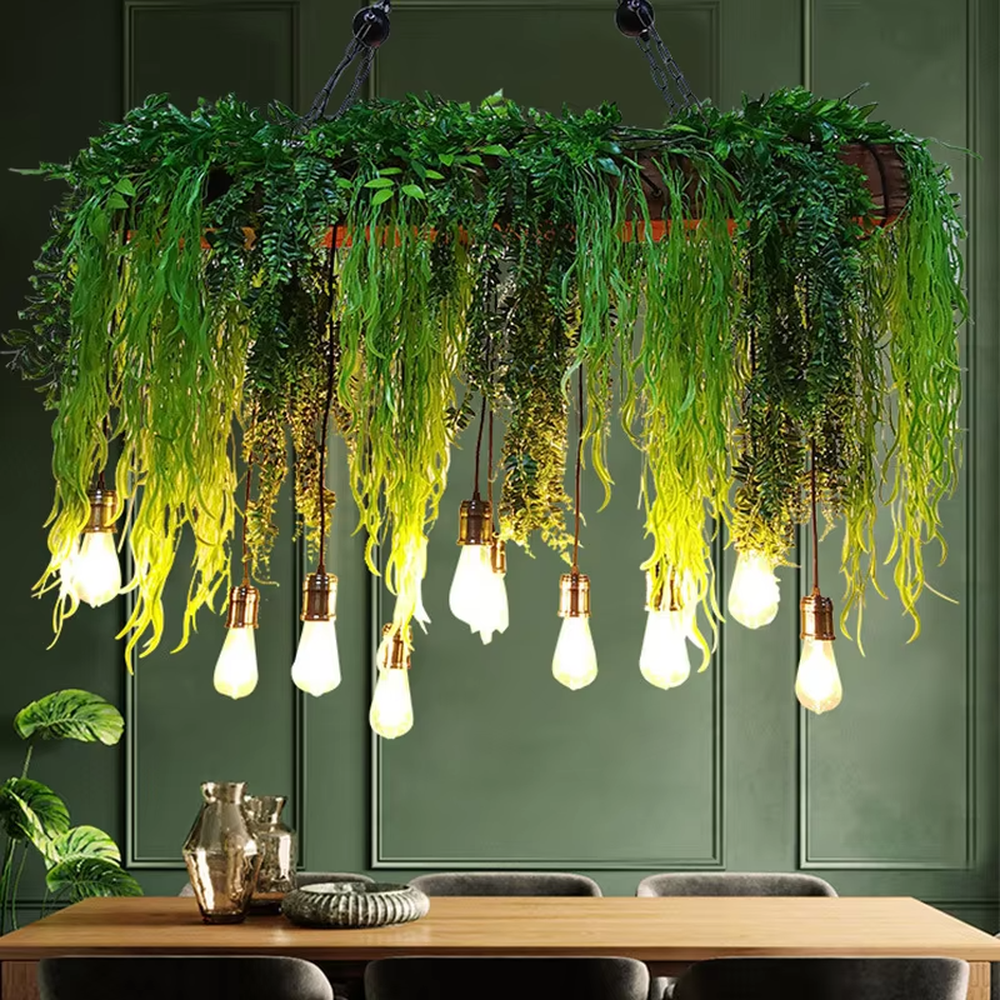 This is a romantic natural-style long strip floral retro chandelier, with blue and white artificial flowers (hydrangeas, orchids, etc.) and green plants as the main decoration, paired with retro bulbs. It has a fresh and romantic style, with warm and soft lighting.