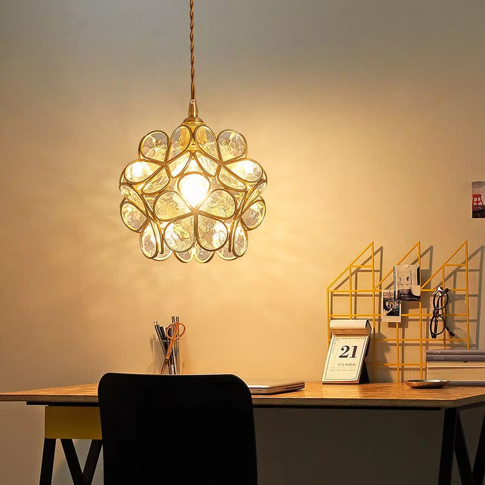 Retro light luxury petal spherical chandelier, golden metal petal frame + textured transparent glass panels + jute rope hanger, soft warm light with textured light and shadow, creating a warm artistic atmosphere.