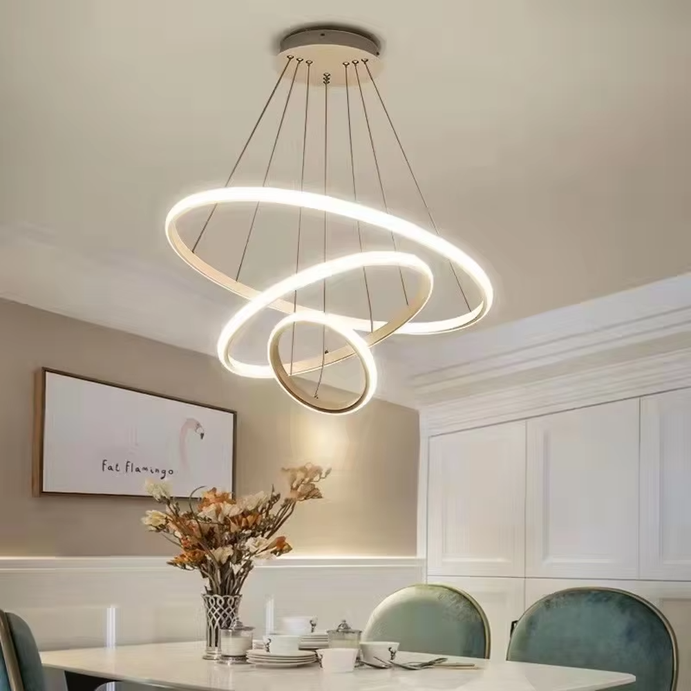 This is a modern smart-style golden ring multi-layer chandelier, with multiple golden ring light strips hanging in layers. It supports 3 levels of brightness and 3 color temperatures (warm light, neutral light, white light) adjustment. The design is minimalist and grand, and the lighting effect can be adjusted according to needs. It is used for space lighting and atmosphere creation, suitable for modern minimalist living rooms, light luxury-style bedrooms, high-end offices and other places.
产品介绍