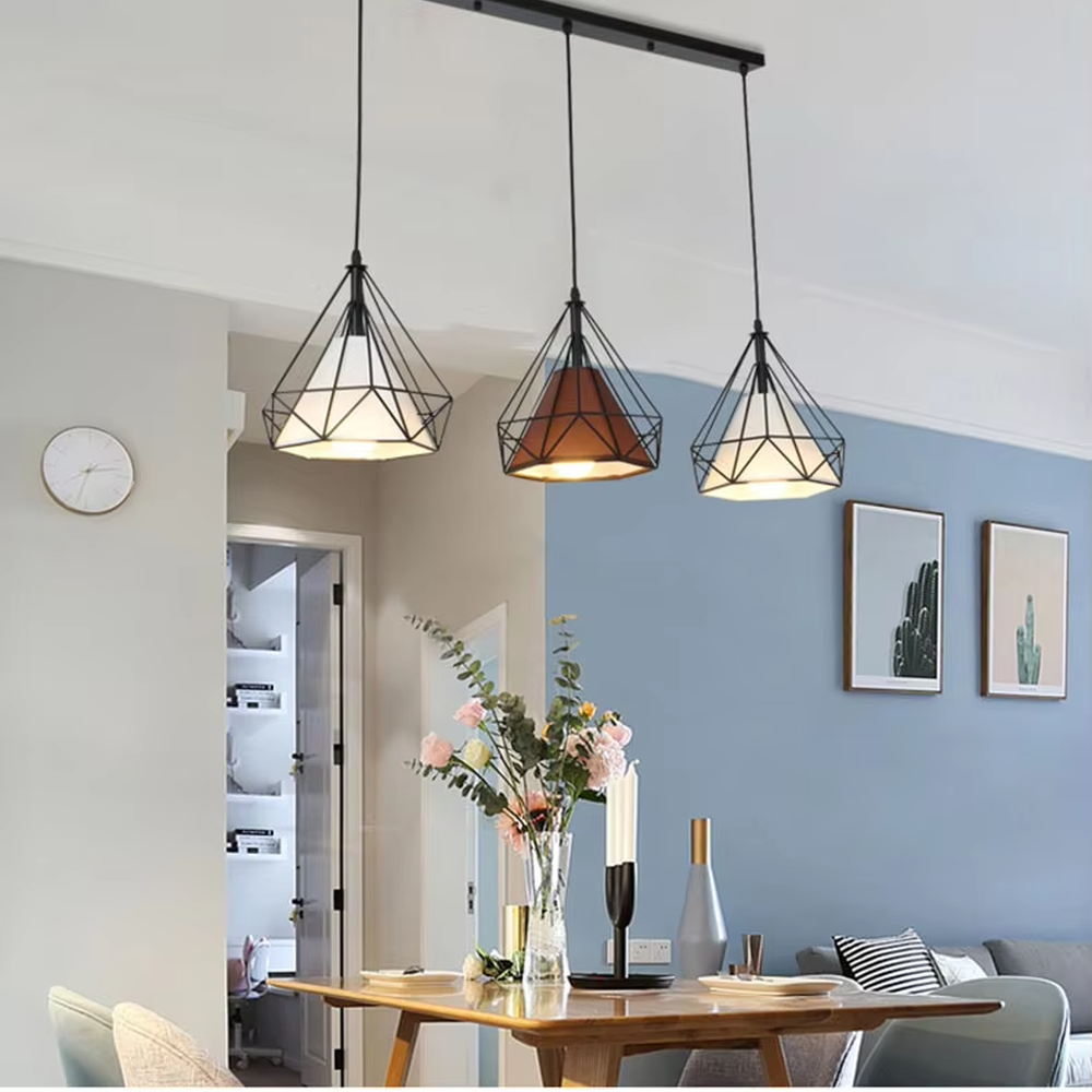 Nordic industrial style three-head iron chandelier, with black geometric rhombus metal frames and semi-transparent lampshades, three-head side-by-side design, soft and even light, used for lighting and decoration in dining tables, bars and other areas, suitable for modern minimalist, industrial style home and commercial spaces