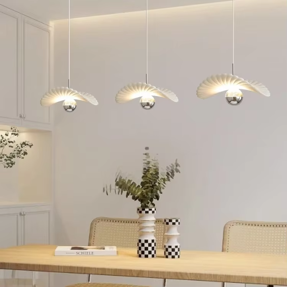Modern minimalist wing-shaped white shade + silver ball multi-head pendant light, warm light effect, creating a fresh and natural space atmosphere.