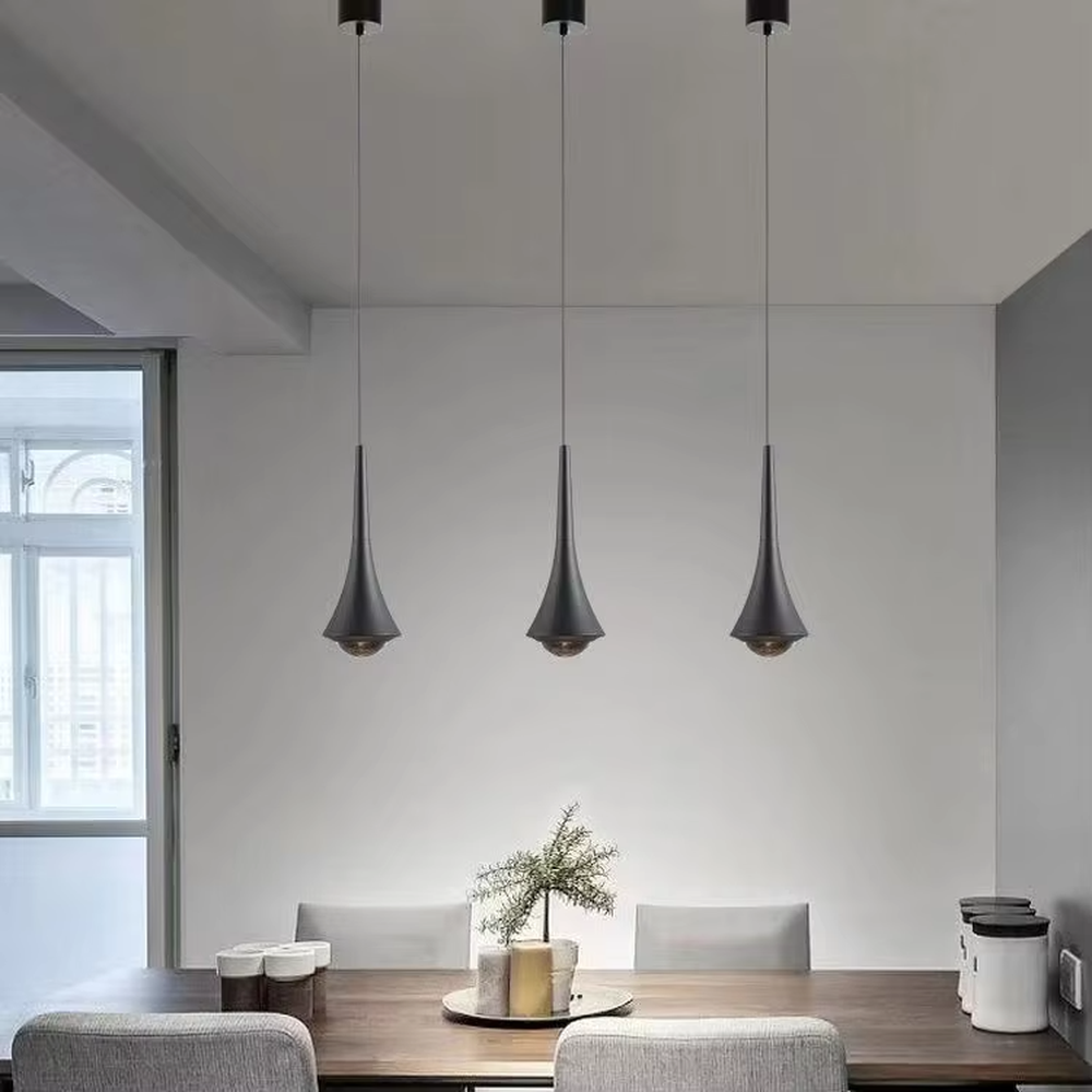 This minimalist light luxury conical small chandelier features a water-drop shape made of black-gold metal, with a thin gold rod on top, projecting soft light spots, serving both lighting and decorative purposes, ideal for bedroom bedside tables, dining bars, light luxury commercial spaces and other scenarios.