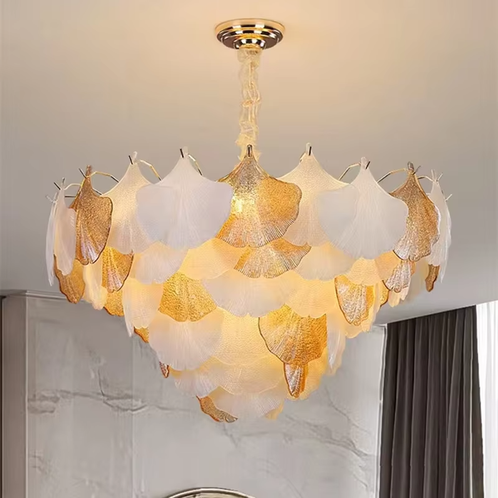 This is an artistic ginkgo leaf-shaped ceiling lamp, featuring gradient (off-white to light gold) textured leaf-shaped lampshades paired with golden metal connectors. The lighting is soft and warm, creating a natural and elegant space atmosphere.