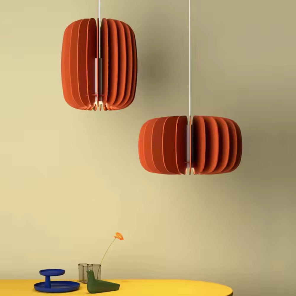 Modern artistic red pleated petal-shaped hanging chandelier, soft fabric material, soft and warm lighting, creating a stylish artistic atmosphere.