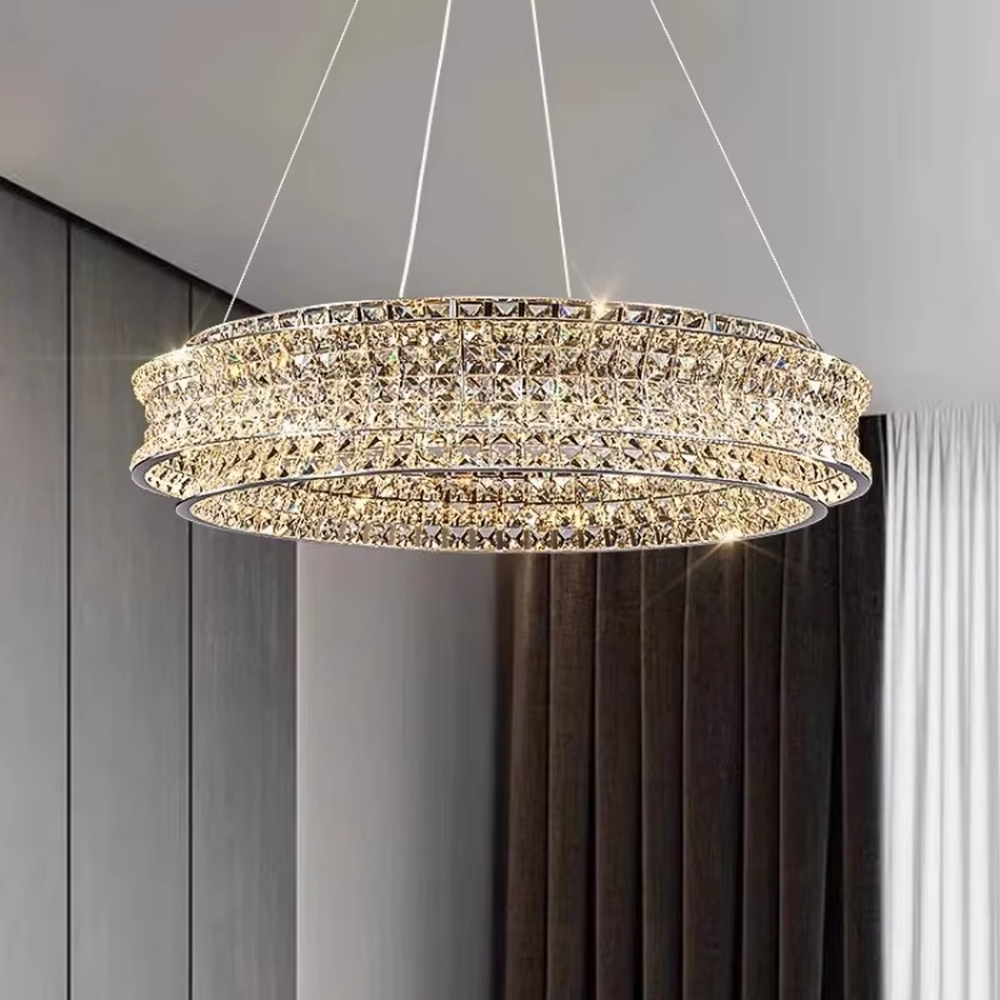 This is a light luxury and luxurious double-layer ring crystal chandelier, with a double-layer ring shape full of crystals. When lit, the light is brilliant and gorgeous, creating a high-end luxurious atmosphere.