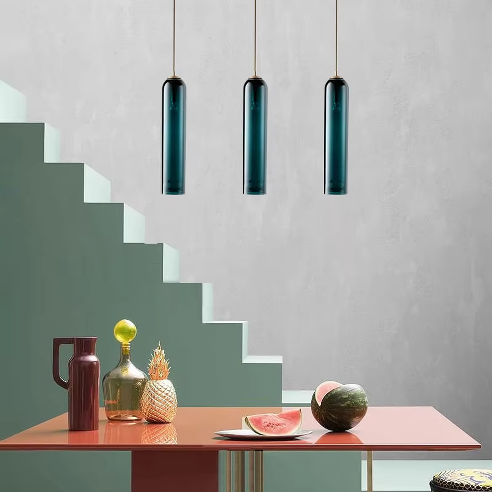Modern minimalist multi-color glass cylinder chandelier (gold/black top trim), warm light effect, creating a fresh and versatile minimalist space atmosphere.