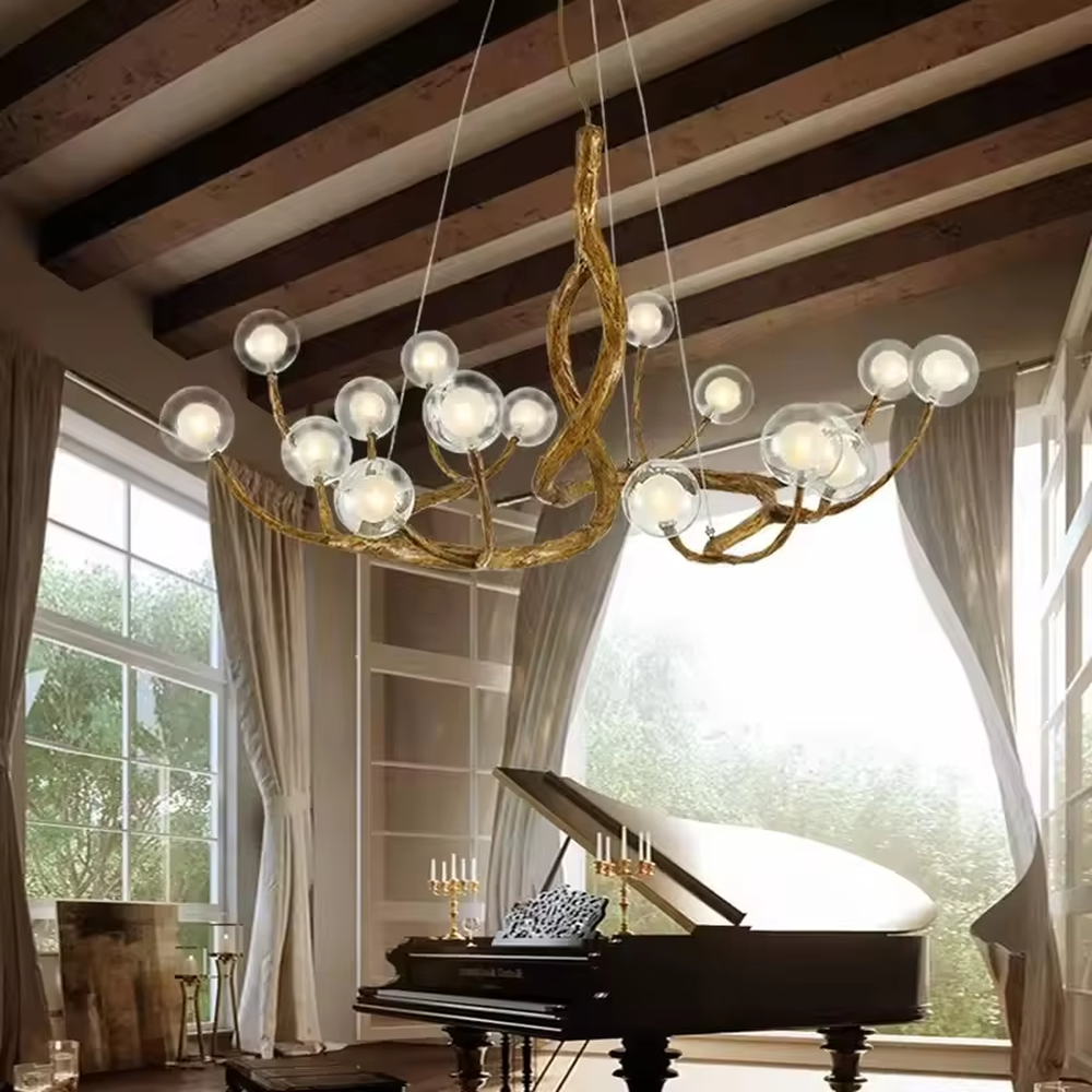 This is a luxury natural-style branch-shaped chandelier with golden metal branch-like brackets and multiple transparent spherical lampshades. It features a highly artistic design with a natural luxury ambiance. It is used for space lighting and decoration, creating a natural artistic visual focus. It is suitable for luxury-style home living rooms, art villa spaces, high-end music rooms and other places.