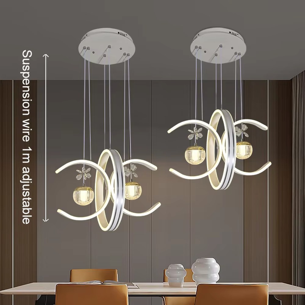 This modern light luxury chandelier features interlaced ring-shaped LED bodies and spherical crystal lamp shades with dragonfly decorations. It has smooth, layered lines, serves both lighting and decorative purposes, and is ideal for modern home spaces like dining rooms and living rooms, as well as light luxury commercial venues.