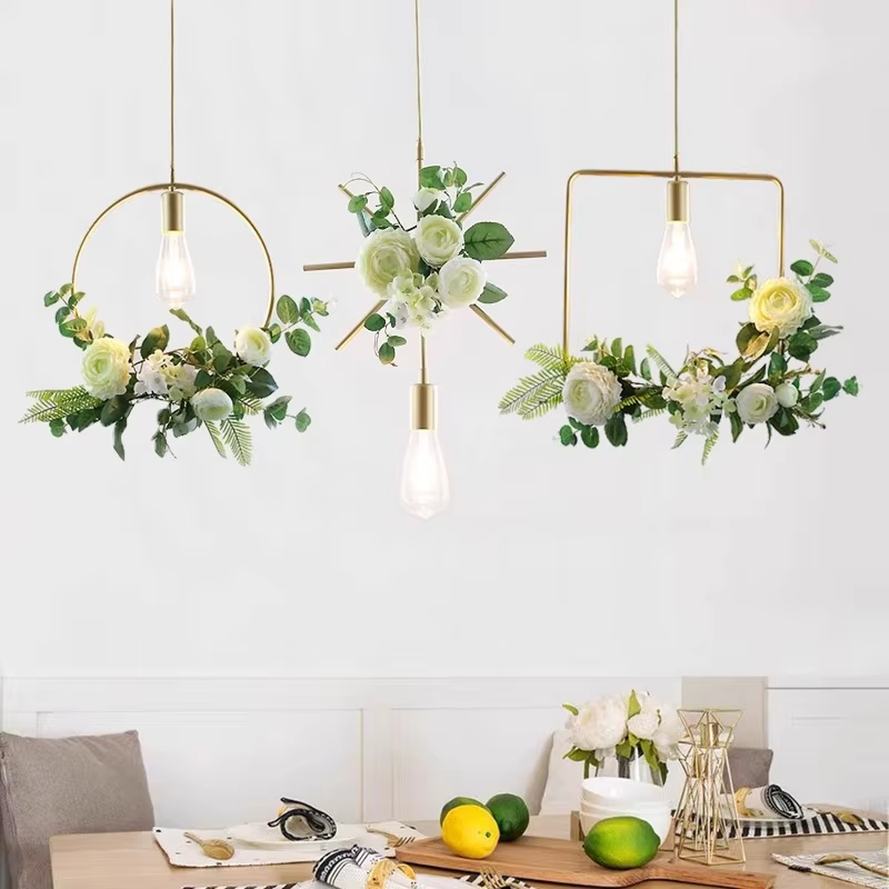 This is a natural and fresh floral metal chandelier, including two styles of golden circular and radial metal frames, paired with artificial green plants, flowers and transparent bulbs. It features a natural and romantic design with warm and soft lighting. It is used for space lighting and decoration, creating a natural and romantic atmosphere. Suitable for Nordic-style homes, literary cafes, wedding venues, art homestays and other places.