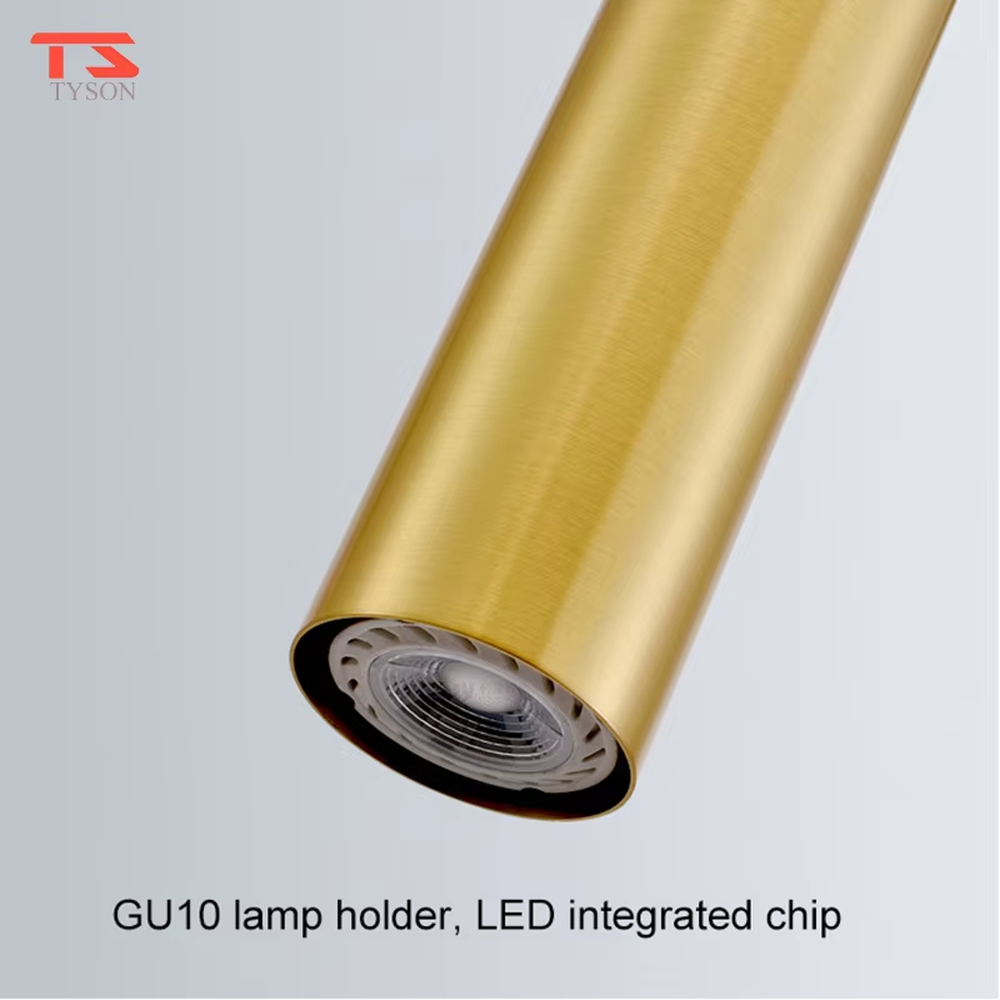 This modern light luxury linear chandelier is made of gold metal, paired with five cylindrical lamp heads, arranged in a linear scattered layout. It serves both lighting and decorative purposes, ideal for modern light luxury spaces such as dining rooms, bars, and open kitchens.