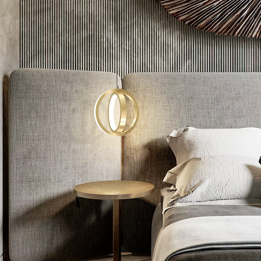 Light luxury double-ring staggered wall lamp (gold metal ring + built-in light strip), warm light effect, creating a stylish and high-end bedroom atmosphere.