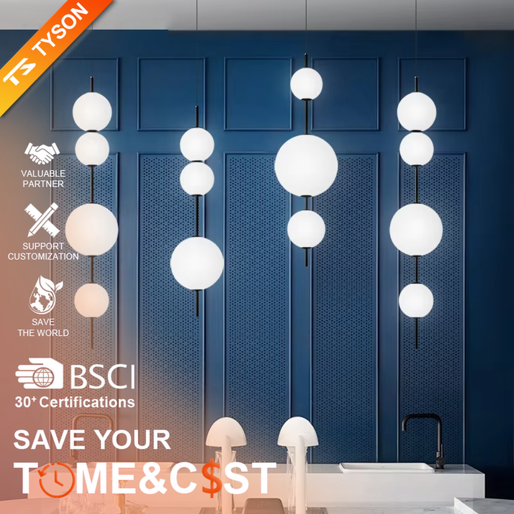 Modern tiered glass ball chandelier (black-white tiered balls + minimalist hanging rod), warm light effect, creating a simple and artistic space atmosphere.