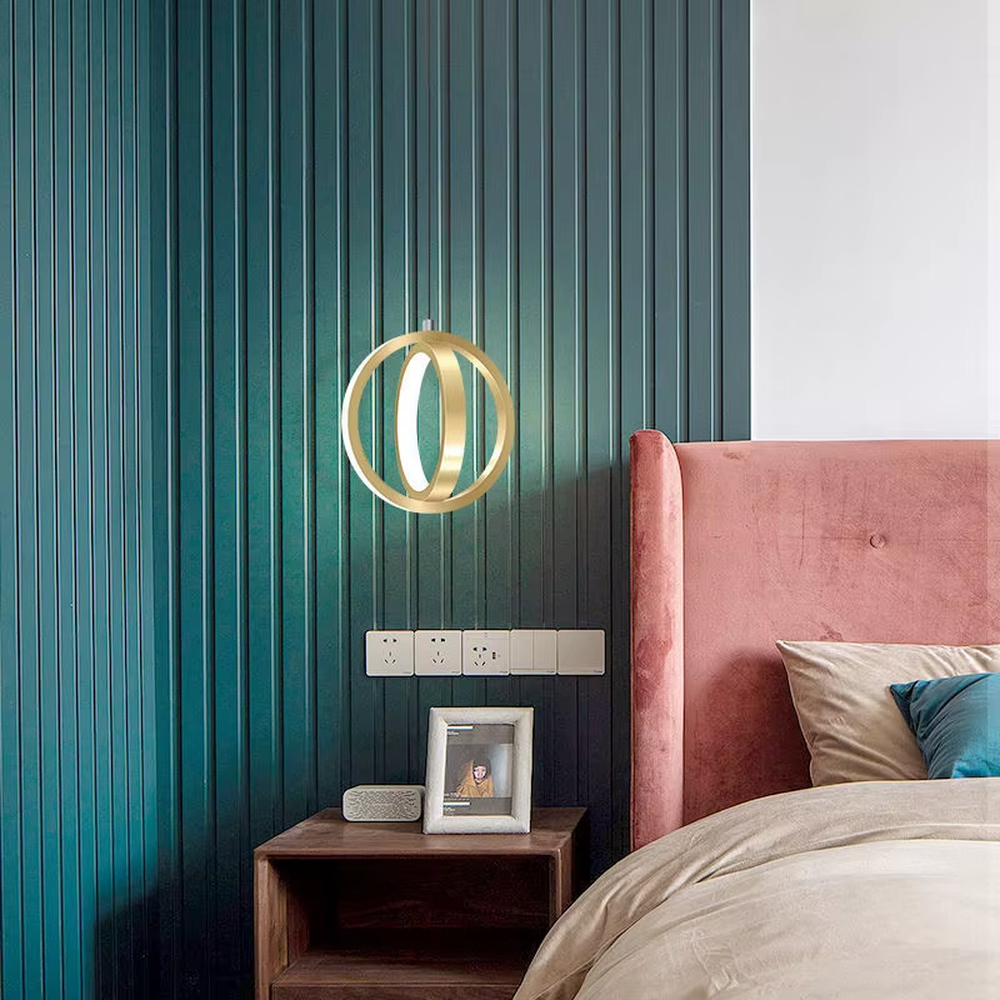 Light luxury double-ring staggered wall lamp (gold metal ring + built-in light strip), warm light effect, creating a stylish and high-end bedroom atmosphere.