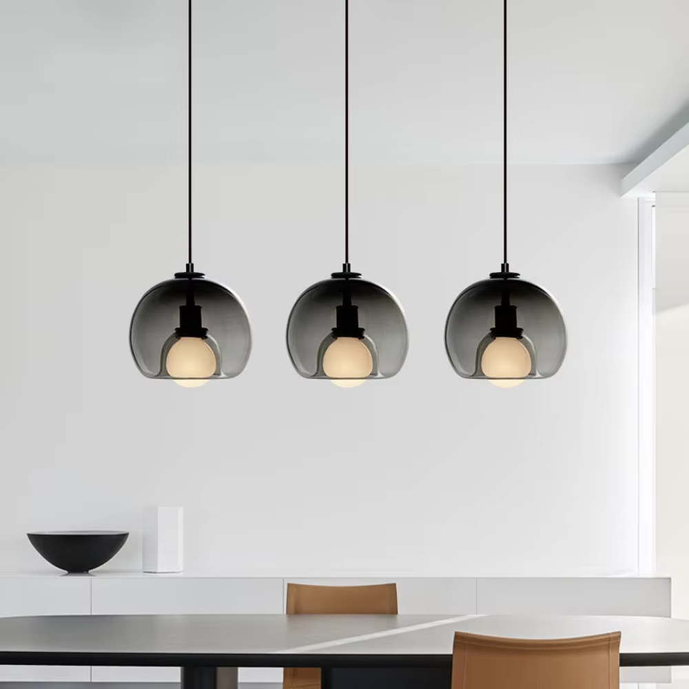 Modern minimalist dark green glass hemisphere chandelier, warm light effect, creating a high-quality minimalist space atmosphere.