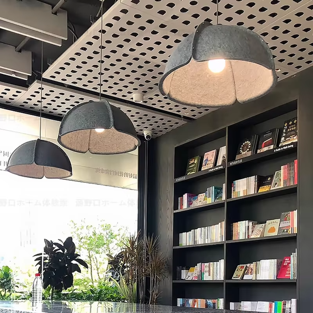 This is a modern minimalist gray spliced dome chandelier, with a gray spliced dome shape, metal rivet details, and an inner warm light design, featuring a minimalist and grand style. It is used for space lighting and decoration, creating a warm and modern atmosphere. Suitable for modern minimalist living rooms, Nordic-style restaurants, creative office areas and other places.