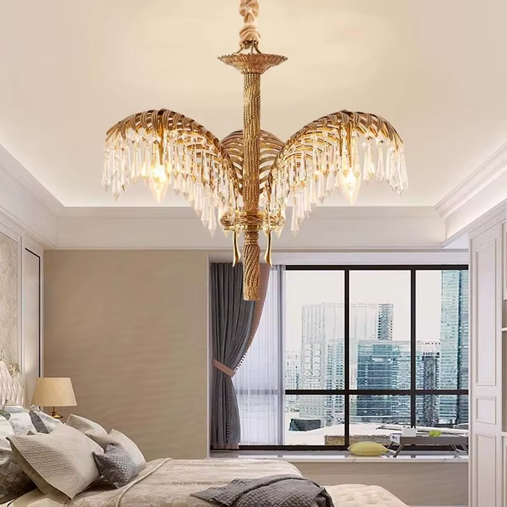 This is a luxurious tropical-style golden palm leaf crystal chandelier, with a golden metal palm leaf structure and numerous crystal pendants, featuring strong luxury and tropical artistic sense, brilliant lighting. It is used for space lighting and decoration, creating a high-end luxurious tropical atmosphere. Suitable for luxury villa living rooms, tropical-themed restaurants, high-end hotel lobbies and other places.