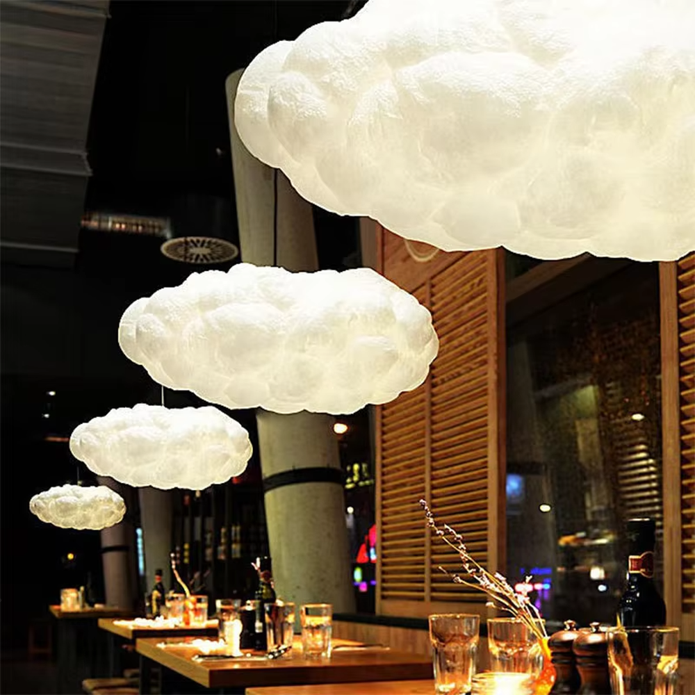 This dreamy cloud-shaped chandelier is made of fluffy fiber/fabric material, simulating the shape of real clouds, transmitting light softly and hung in varying sizes. It serves both lighting and decorative purposes, ideal for Internet celebrity restaurants, cafes, children's rooms, cultural and creative spaces and other scenarios.
