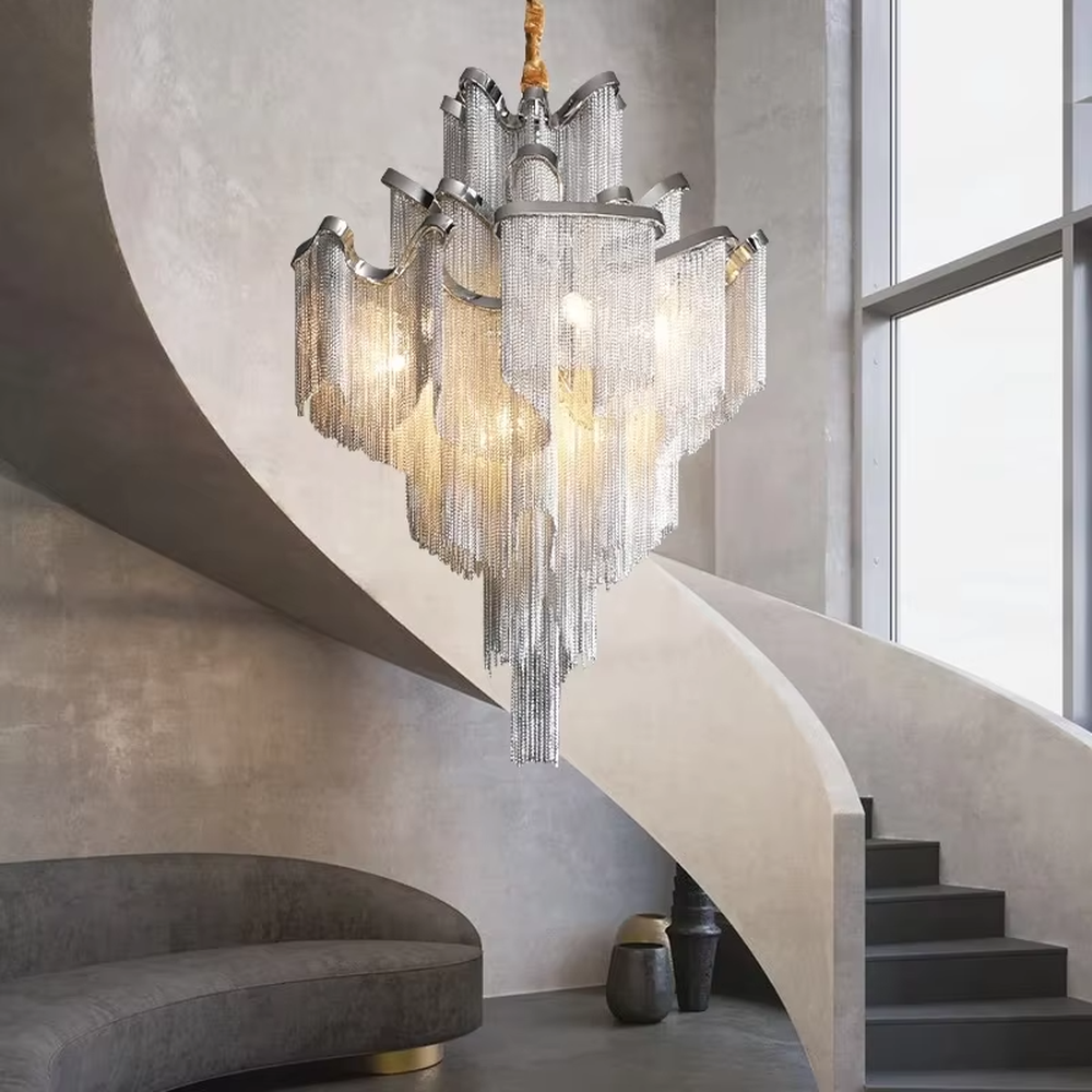 Modern light luxury silver frame crystal tassel irregular-shaped chandelier, warm light effect, creating a luxurious artistic atmosphere.