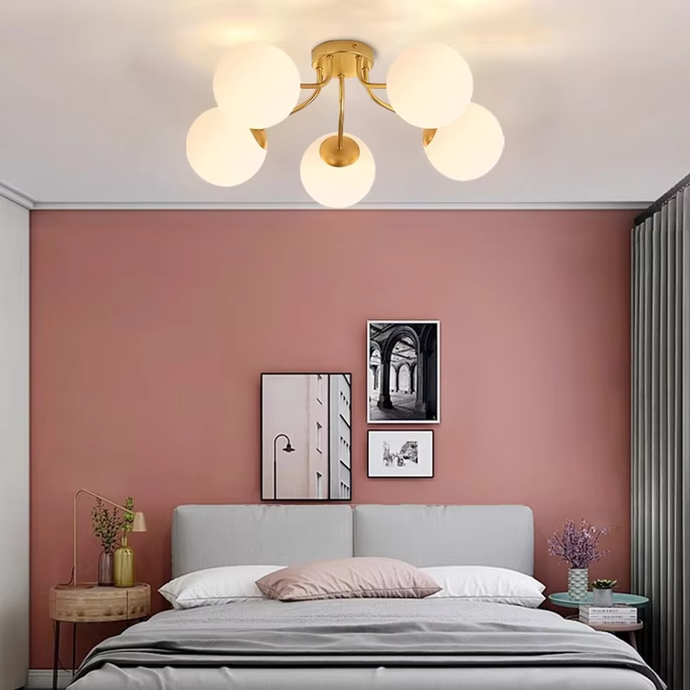 This is a Nordic modern luxury spherical ceiling light, with a golden metal branched stand and multiple white spherical frosted lampshades, featuring a minimalist modern design and strong luxury sense. It is used for space lighting and decoration, creating a warm modern luxury atmosphere. It is suitable for modern luxury home living rooms, Nordic-style bedrooms, designer studios and other places.