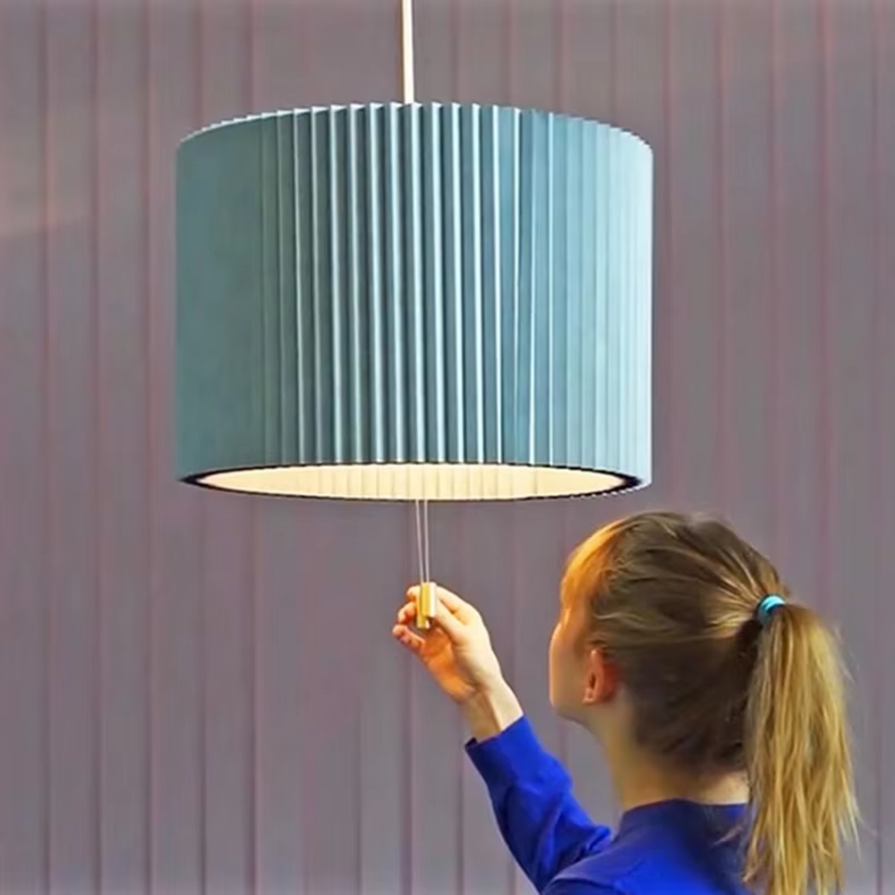 This modern minimalist fan-shaped chandelier features a light lake blue pleated fabric lampshade with a black edge, in an umbrella-shaped suspended style, serving both lighting and decorative purposes, ideal for modern minimalist spaces such as dining rooms, living rooms, and wabi-sabi cafes.