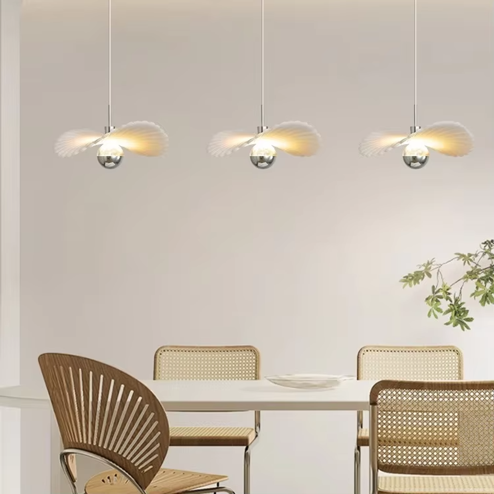 Modern minimalist wing-shaped white shade + silver ball multi-head pendant light, warm light effect, creating a fresh and natural space atmosphere.