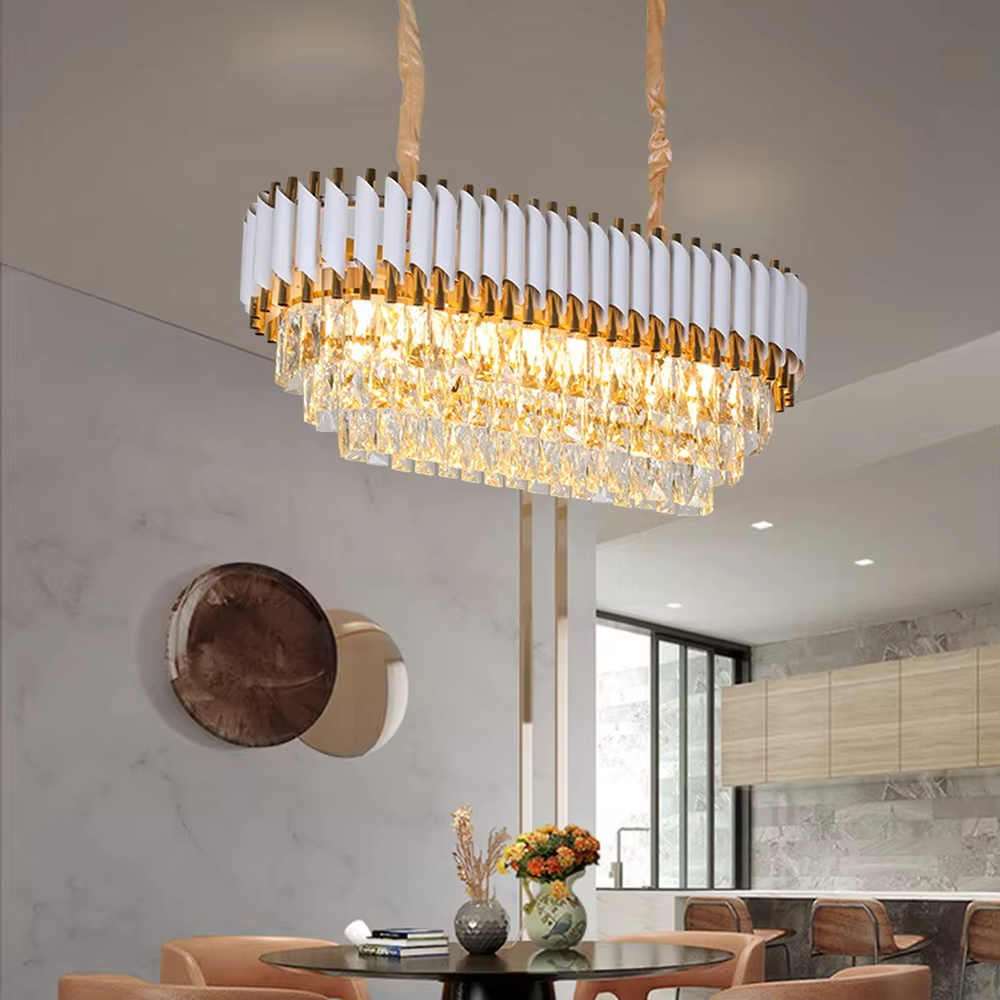 This is a modern luxurious white and gold multi-layer crystal chandelier, with white and gold top decorations paired with numerous transparent crystal pendants. It features a grand and luxurious design with brilliant lighting. It is used for space lighting and decoration, creating a luxurious high-end atmosphere. Suitable for light luxury-style living rooms, high-ceiling spaces in luxury villas, high-end hotel lobbies and other places.