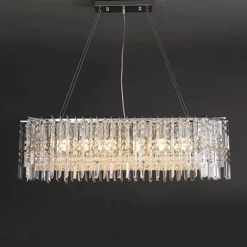 Luxury rectangular crystal chandelier (multi-faceted cut crystals + polished metal), warm light effect, creating a brilliant and high-end light luxury space atmosphere.