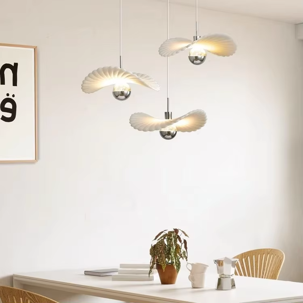 Modern minimalist wing-shaped white shade + silver ball multi-head pendant light, warm light effect, creating a fresh and natural space atmosphere.