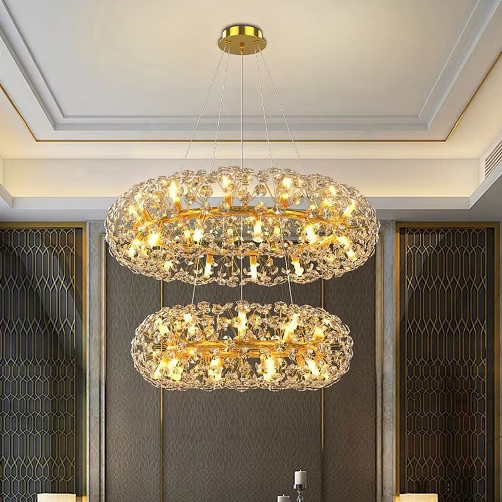 Light luxury oval dandelion-shaped golden frame crystal chandelier, warm light effect, creating an exquisite artistic space atmosphere.