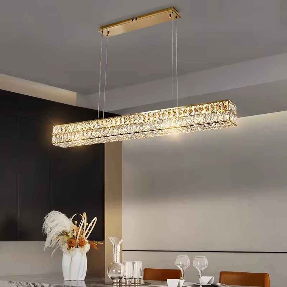 Light luxury modern long-shaped cut crystal chandelier, golden frame + full-set diamond-cut crystals + warm light effect, creating a luxurious dining atmosphere.