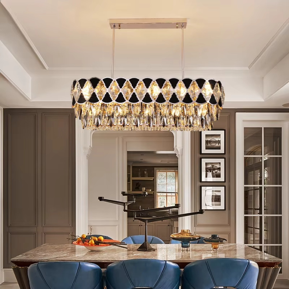 This is a light luxury and luxurious long strip chandelier, with black-silver diamond decorations on the upper layer and golden crystal pendants hanging on the lower layer. When lit, the light is brilliant and high-end, creating a high-end luxurious atmosphere.