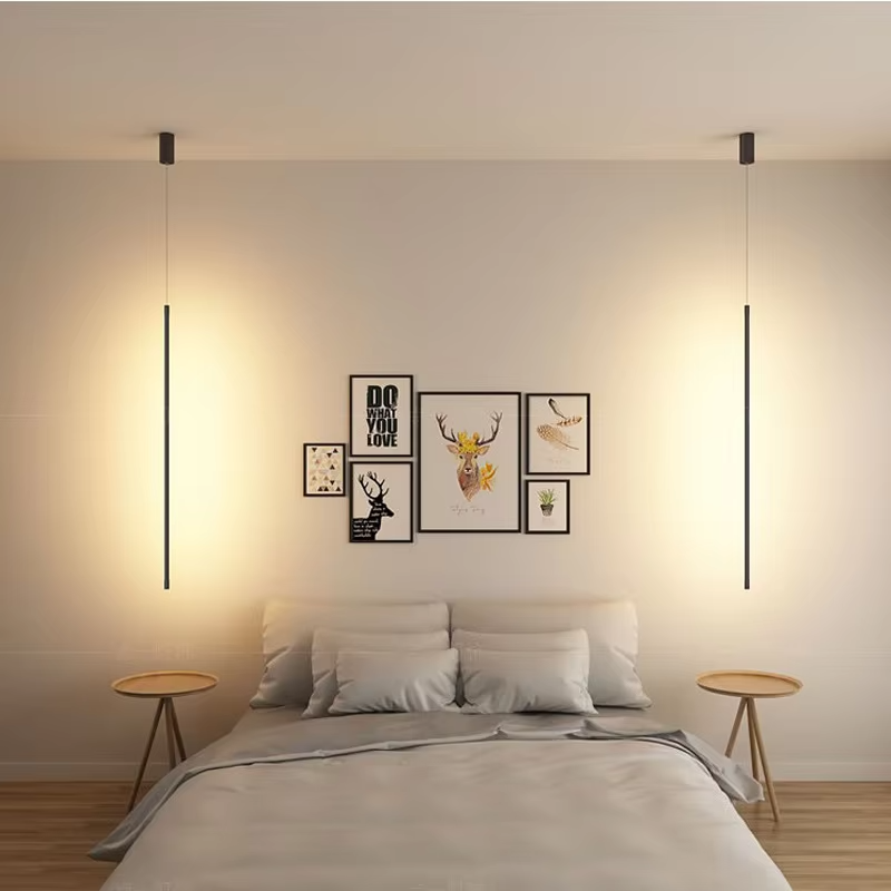 This minimalist linear chandelier features a slender black metal lamp body with a floating suspension design, emitting soft diffused light, serving both lighting and decorative purposes, ideal for bedroom bedside tables, living room feature walls, modern minimalist homes and other scenarios.