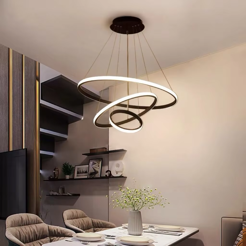 This is a modern smart-style golden ring multi-layer chandelier, with multiple golden ring light strips hanging in layers. It supports 3 levels of brightness and 3 color temperatures (warm light, neutral light, white light) adjustment. The design is minimalist and grand, and the lighting effect can be adjusted according to needs. It is used for space lighting and atmosphere creation, suitable for modern minimalist living rooms, light luxury-style bedrooms, high-end offices and other places.
产品介绍