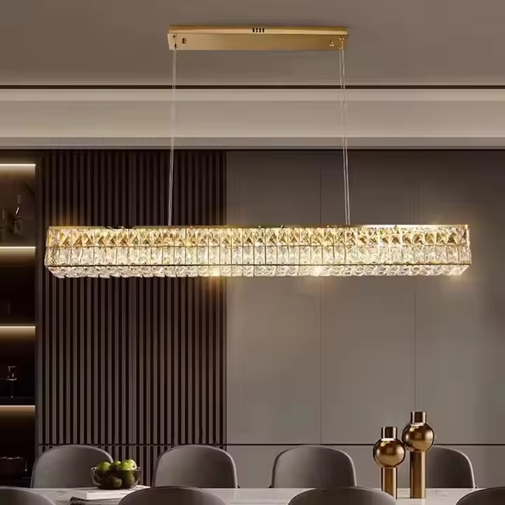 Light luxury modern long-shaped cut crystal chandelier, golden frame + full-set diamond-cut crystals + warm light effect, creating a luxurious dining atmosphere.