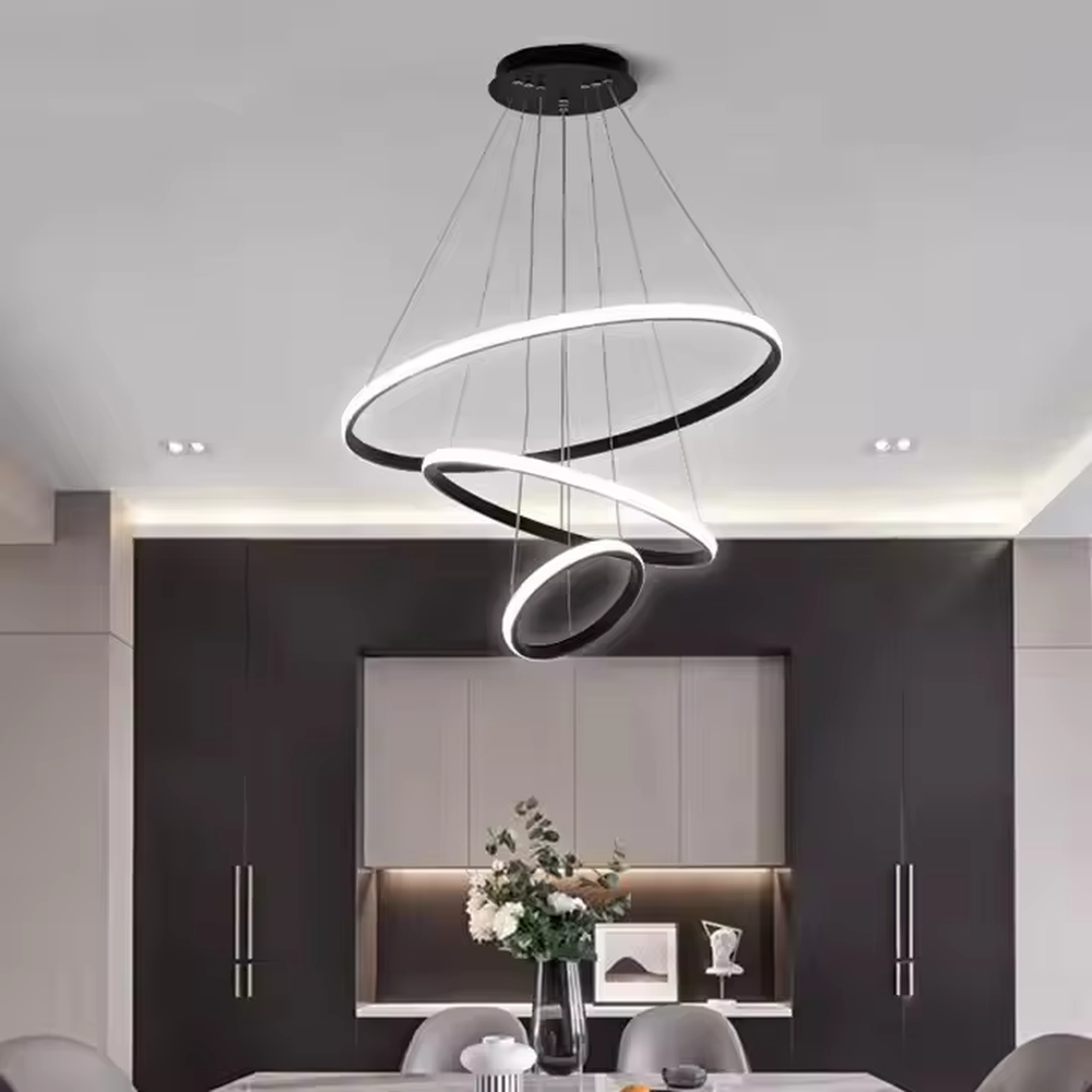 This is a modern smart-style golden ring multi-layer chandelier, with multiple golden ring light strips hanging in layers. It supports 3 levels of brightness and 3 color temperatures (warm light, neutral light, white light) adjustment. The design is minimalist and grand, and the lighting effect can be adjusted according to needs. It is used for space lighting and atmosphere creation, suitable for modern minimalist living rooms, light luxury-style bedrooms, high-end offices and other places.
产品介绍