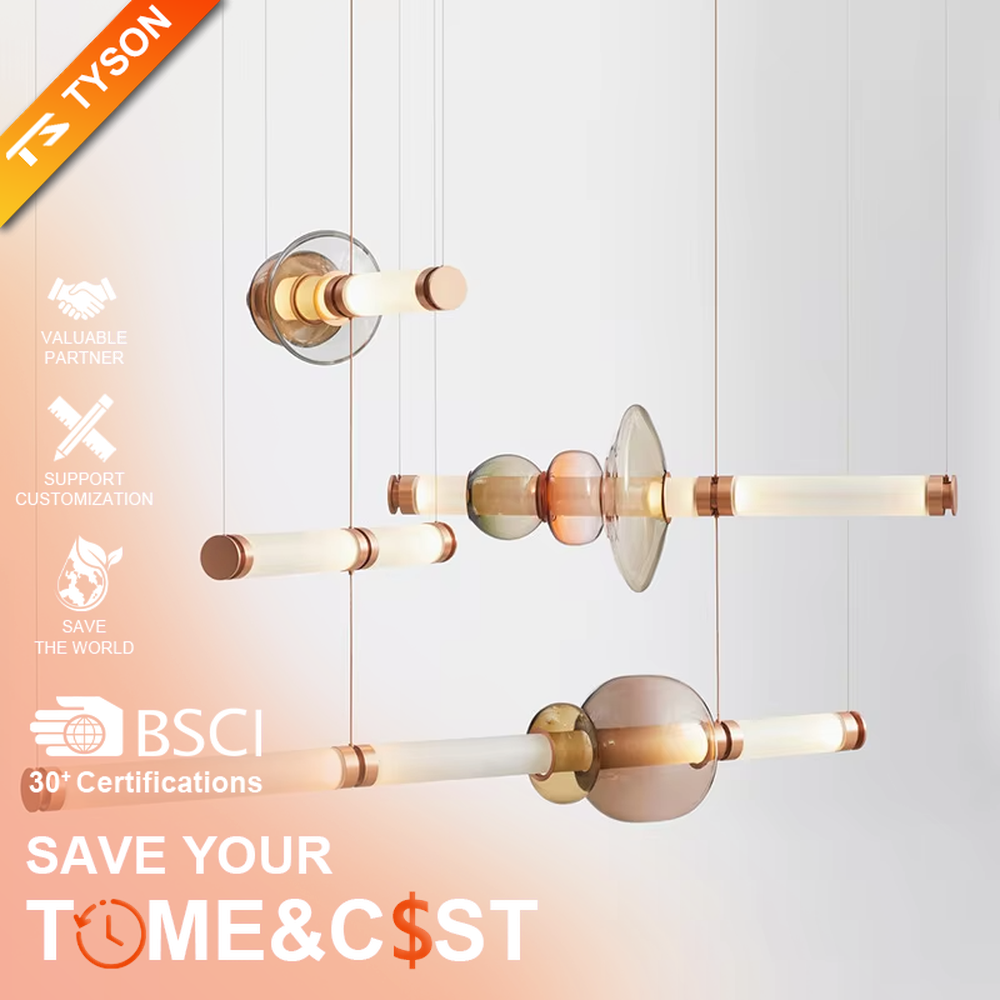 This is a modern artistic layered colorful glass chandelier, featuring a spliced shape of transparent, amber and blue glass, paired with golden metal connectors. The lighting is soft and colorful, creating an artistic and high-end atmosphere.